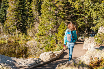 Naklejka na ściany i meble Tourist on trail near Bear Lake in Colorado