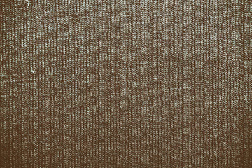 Dark Autumn Maple background from a textile material with wicker, close-up fabric texture.