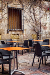 empty terrace tables in the medieval atmosphere