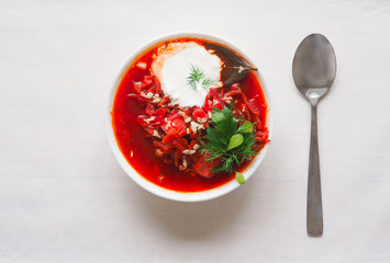 Red beet soup in a white plate. Simple healthy vegetarian food. Ramadan kitchen.
