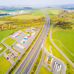 Aerial view of highway rest area with restaurant and large car park for cars and trucks. D5...