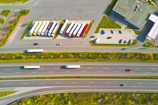 Aerial view of highway rest area with restaurant and large car park for cars and trucks. D5 motorway in west Bohemia, Czech republic, European union. Top view of highway infrastructure.