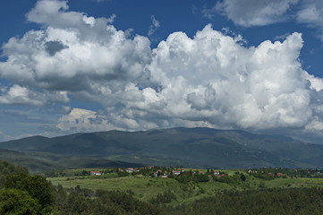 Beautiful landscape of summer nature with green glade and forest in  Plana mountain toward Vitosha mountain, Bulgaria 