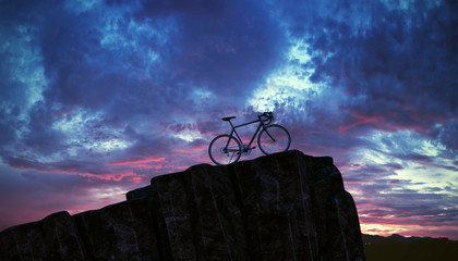 Fototapeta na wymiar bicycle on top of mountain. Sunset. 3d illustration
