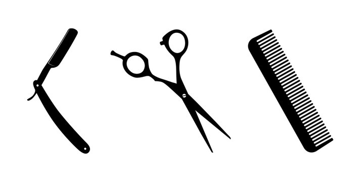 Scissors, knife for shaving, comb on white