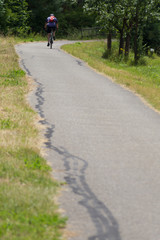 cyclists exercising on a bikeway © rudolfgeiger
