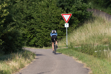 cyclists exercising on a bikeway © rudolfgeiger