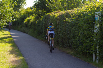 cyclists exercising on a bikeway © rudolfgeiger