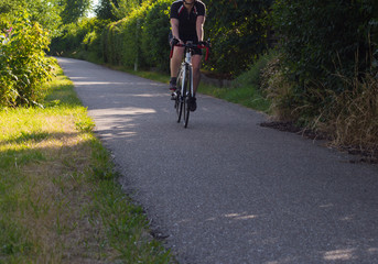 cyclists exercising on a bikeway © rudolfgeiger