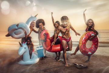 Group of friends having fun on the beach