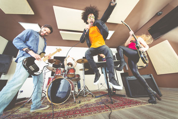 Fototapeta na wymiar Rock band playing hard rock in the studio