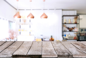 Empty wooden table and blurred background of abstract in front of restaurant or coffee shop for display of product or for montage