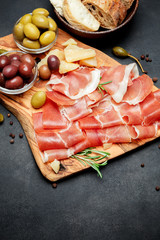 Italian prosciutto crudo or spanish jamon. Raw ham on white background.