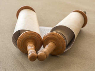 Open Torah scroll on the canvas, the blurred background.