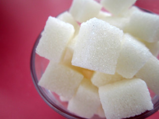 pink sugar cubes on the ground. 