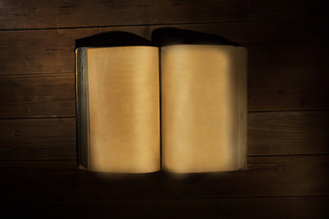 open old book on wooden background