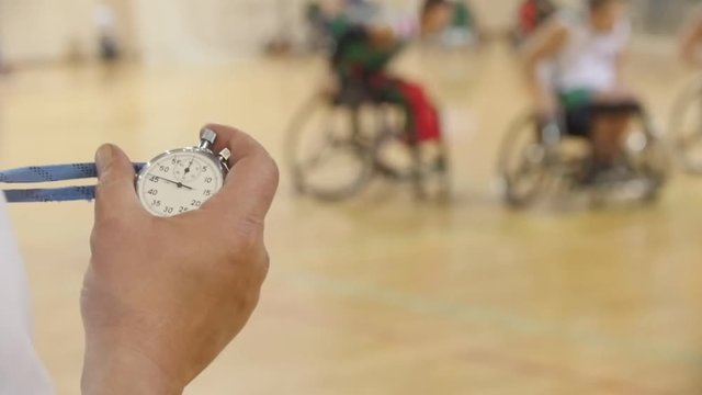 Stopwatch In Hand Of Coach During Training For Wheelchair Basketball, Slow-motion