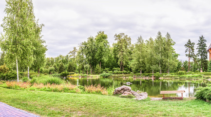 Fototapeta na wymiar Panorama of the spring lake in Mezhyhiria near Kiev.