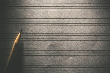 Pencil on the blank sheet music