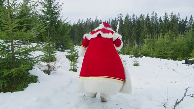 Santa Claus walking on a windy day