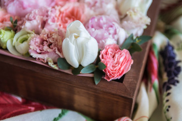 a bunch of fresh beautiful flowers in a brown wooden box