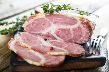 A piece of smoked meat with herbs