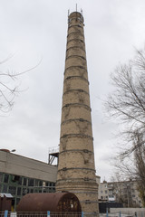 Brick tower. Factory tower of red brick