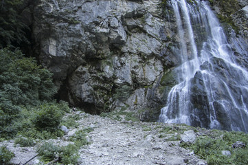 Obraz premium Vertical picturesque natural landscape mountain waterfall