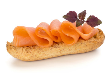 Bread with fresh salmon fillet isolated on white background, top view.