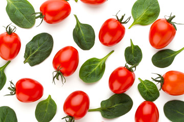 Spinach and tomato pattern background on white. Top view