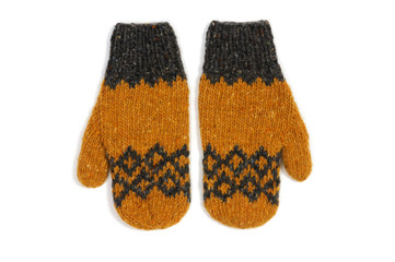 Yellow knitted mittens handmade on a white background. View from above.