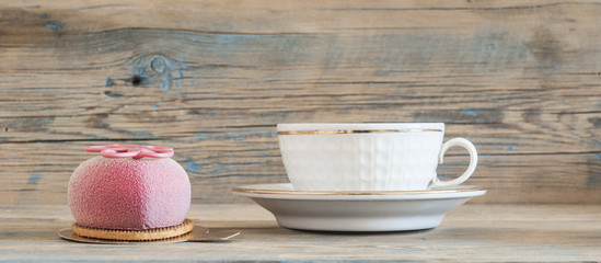 Cupcake on wooden table.