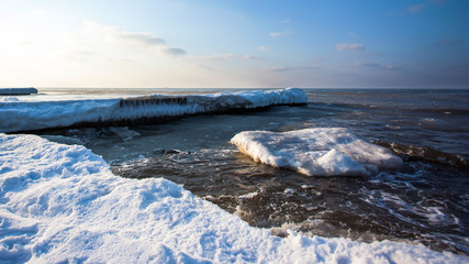 snow-capped beach and frozen sea