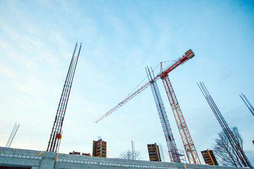 Crane on a large construction site with fittings