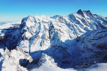 Mountain peaks ridge at winter Swiss Alps