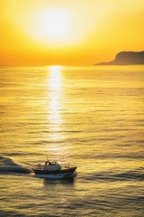 Sunrise and ship in Mediterranian sea in Palermo