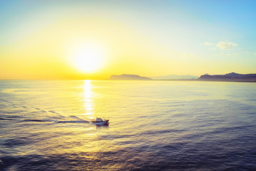 Sunrise and ship at Mediterranian sea at Palermo