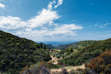 Fototapeta na wymiar At the top of Kassandra, Halkidiki, Greece. Panoramic view of the beautiful landscape of peninsula Kassandra and Nea Skioni town by the sea. 