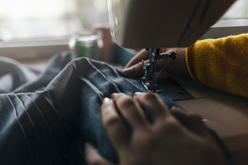  Fashion designer work on the sewing machine.