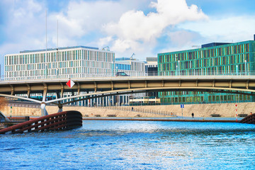 Business downtown and Bridge over Spree River at Berlin Mitte