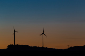 Obraz premium Wind turbines at sunrise