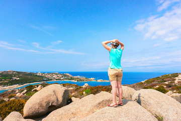Girl looking at panorama Capo Testa Santa Teresa Gallura Sardinia