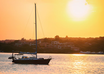 Sunrise with boat at at Mediterranean sea Sardinia