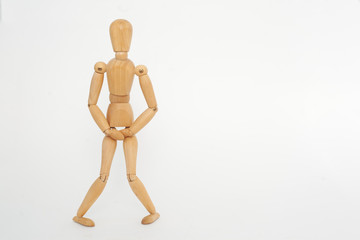 The wooden keeps below the belt. The concept of cystitis. On a white background.