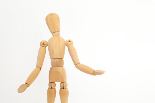 A wooden mannequin offers hugs. On a white background.