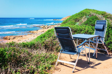 Table with chairs at Capo Pecora resort Sardinia