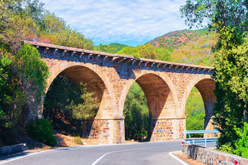 Fototapeta na wymiar Road and aqueduct in Carbonia Iglesias province Sardinia