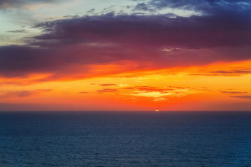 Naklejka na ściany i meble Idyllic sunset over Mediterranean sea at Portoscuso Carbonia Sardinia