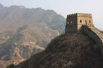 Fototapeta na wymiar watchtower of the great wall of china in bright sun light