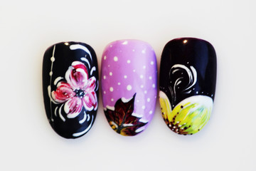 three plastic tips for nail extension and training in applying design while training a manicure on...